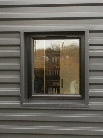 Intervention pour l'ouverture d'un bardage et la pose d'une fenêtre avec finition extérieure